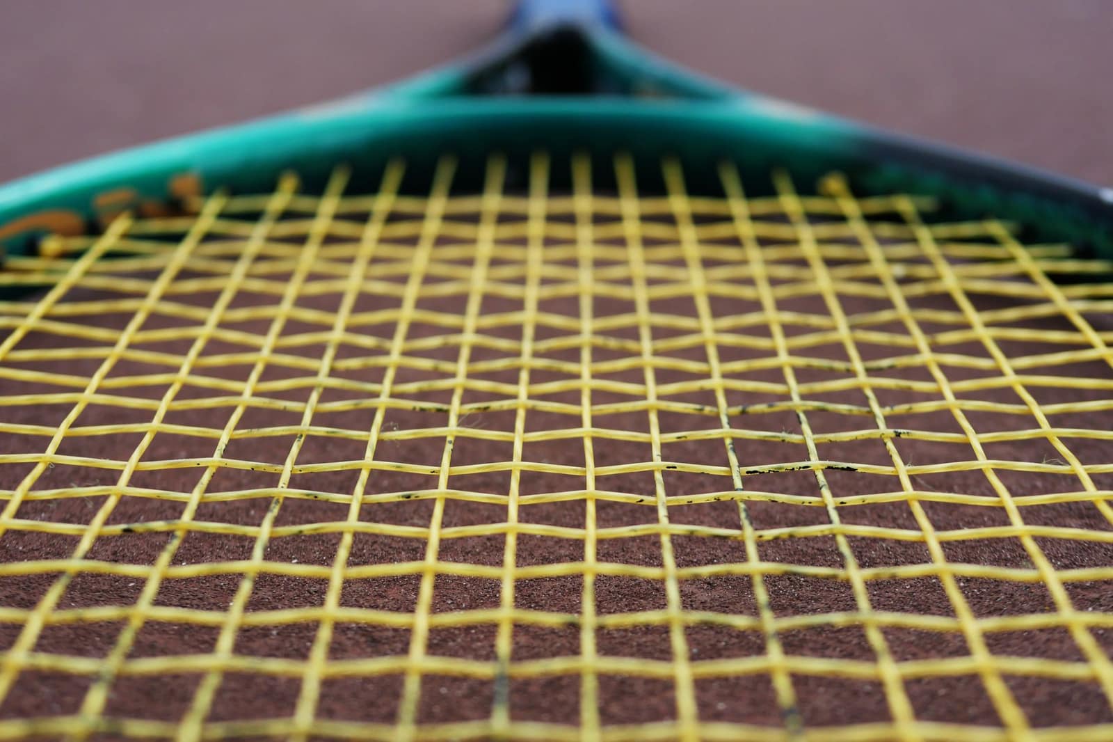 Close-up of a tennis racquet string bed